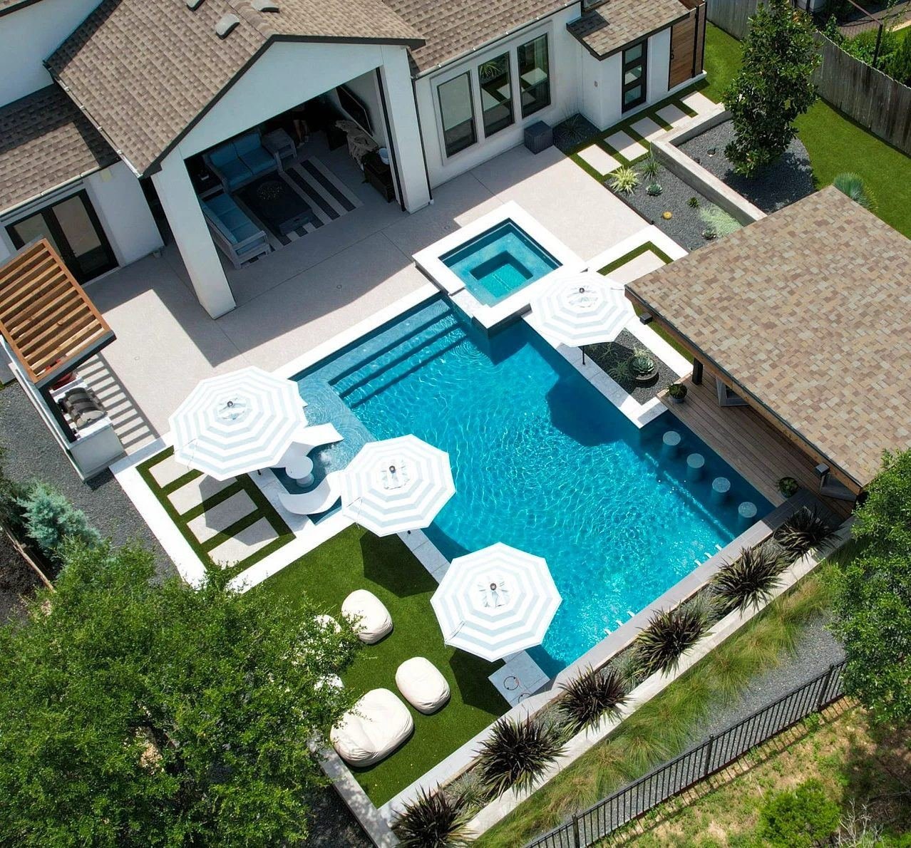Custom pool with spa and umbrellas seen from above